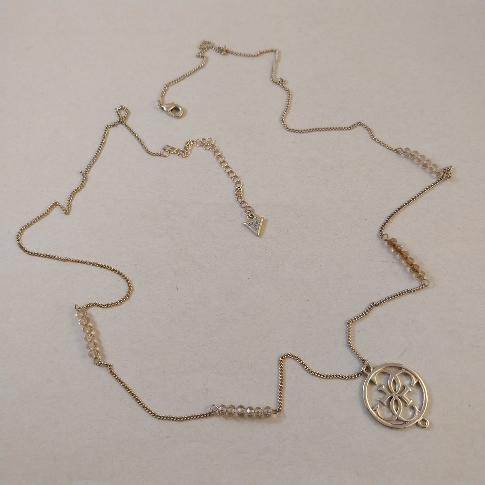 Guess Gold and Crystal Pendant Necklace - Picture 8 of 13